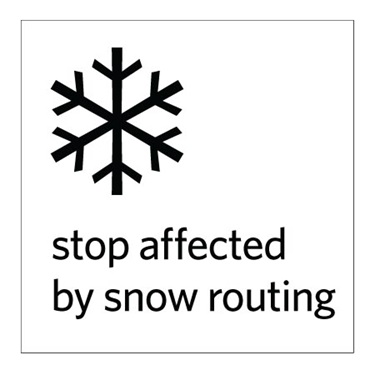 white bus stop sign indicating snow routing